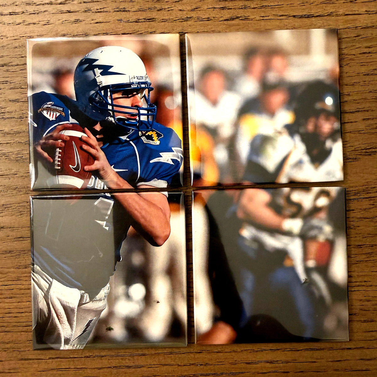A four-magnet photo mosaic laid out on a wood table